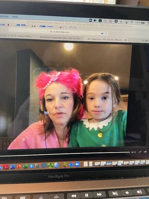 professor with her daughter in an elf costume